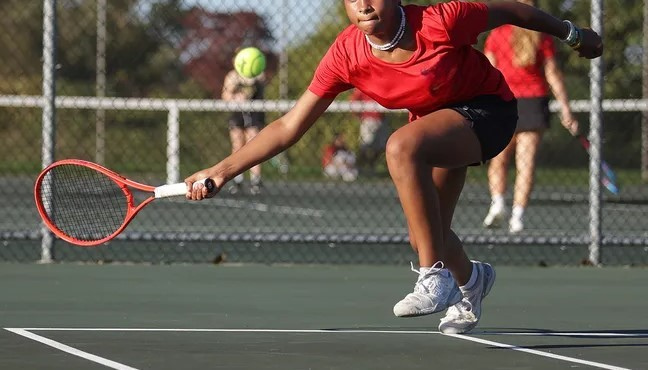TENNIS MAKES QUICK WORK OF THE HUSKIES